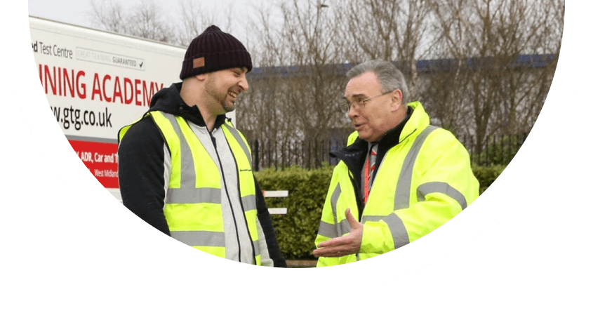 Trainee driver and Trainer talking and laughing