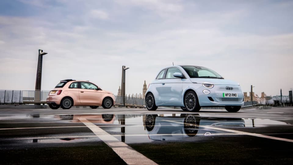 Two Fiat 500 cars