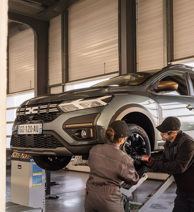 Experts working on car