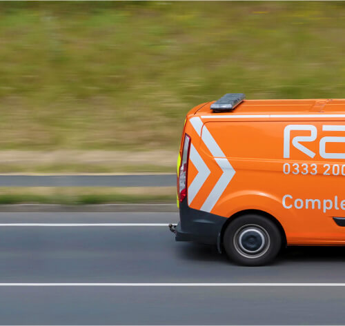 Image of orange RAC van on motorway