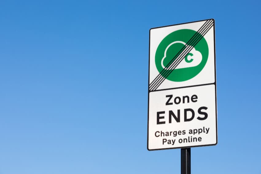 A picture of a CAZ road sign with the sky in the background